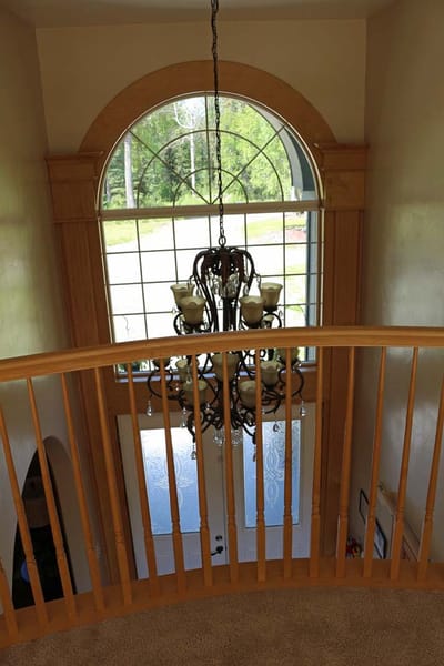 Interior view of a stairway with chandelier