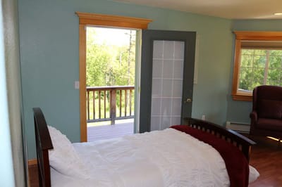 Cozy resident room with a bed and balcony view