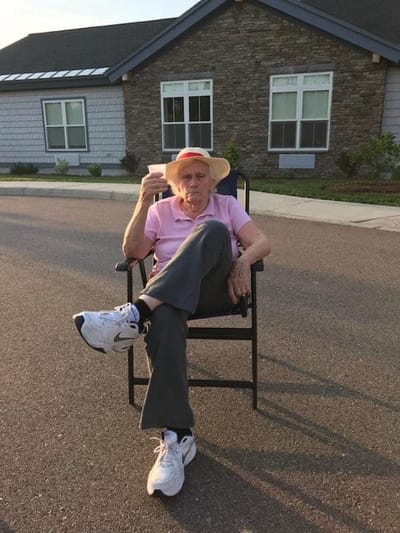Resident enjoying the outdoors at Maple Ridge Lodge