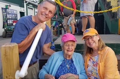Residents enjoying outdoor time with staff members