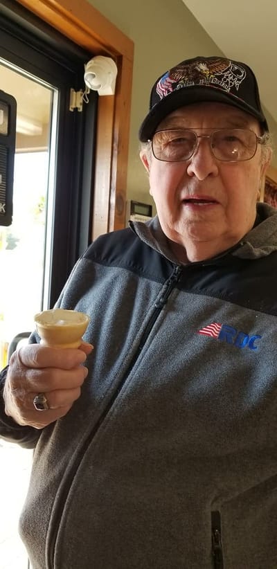 A resident enjoying ice cream in a common area