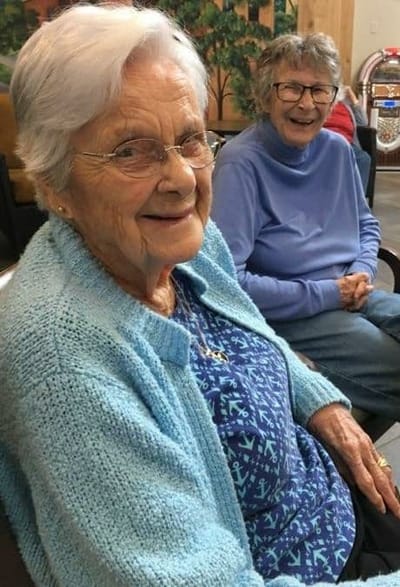 Smiling residents enjoying their time together in the facility