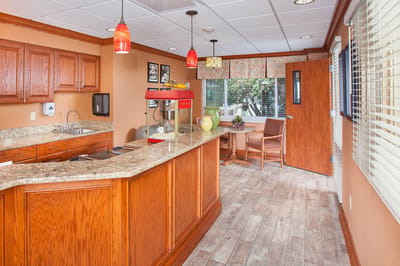 Bright interior common area with a kitchenette