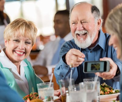 Residents enjoying a meal and smiling together