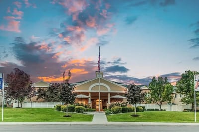 Exterior view of Legacy House with a sunset backdrop