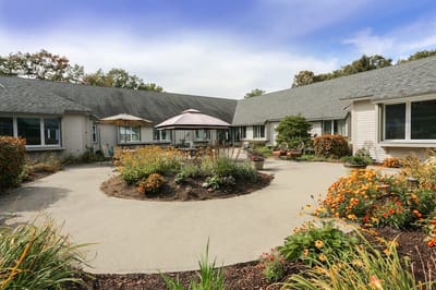 Outdoor garden area with seating and flowers