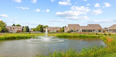 Scenic view of a pond and facility buildings