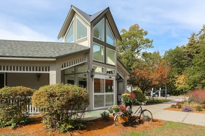 Exterior view of a senior living facility with landscaping