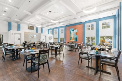 Dining area set up for a meal with colorful table settings