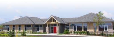 Exterior view of a senior care facility with landscaping