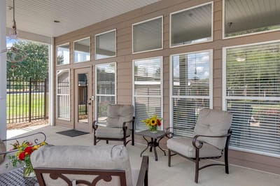 Outdoor seating area with flowers and sunlight