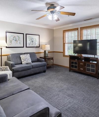 Cozy common area with seating and entertainment system