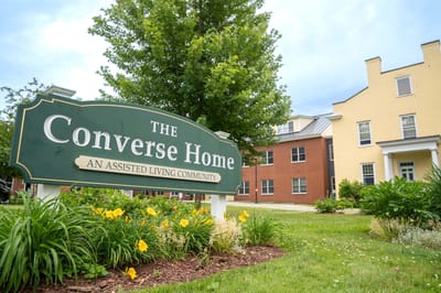 Sign for Converse Home with building in background