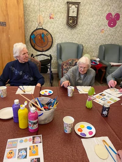 Residents engaged in an arts and crafts activity