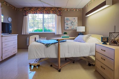 A well-furnished private resident room in the facility