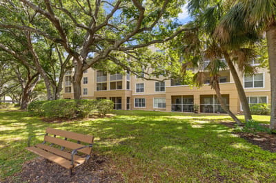 Exterior view of a residential building surrounded by trees