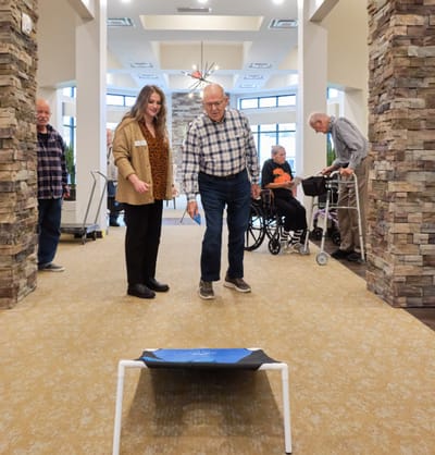 Residents participating in a physical activity in a common area