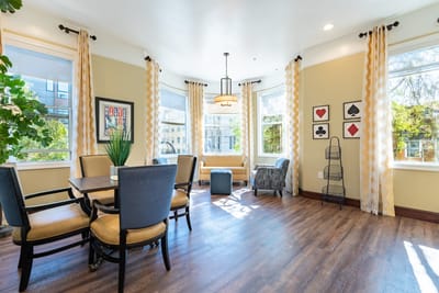Bright common area with seating and natural light