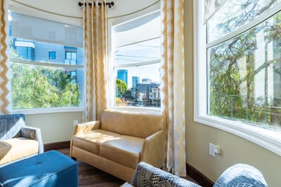 Cozy seating area with large windows and natural light