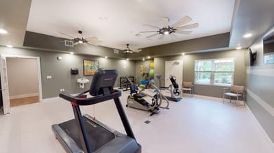 Fitness room with exercise equipment and seating