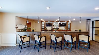 Bar area with seating in a modern lounge