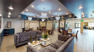 Modern common area with seating and decorative lighting