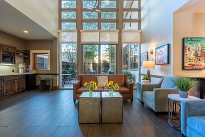Bright interior common area with seating and decor