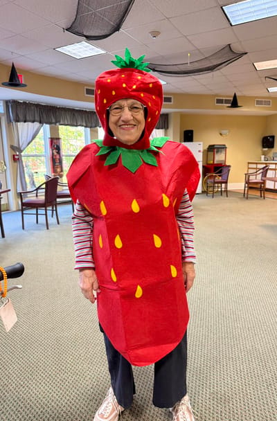 Resident dressed as a strawberry in a common area