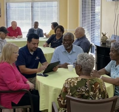 Residents and staff interacting in a communal area