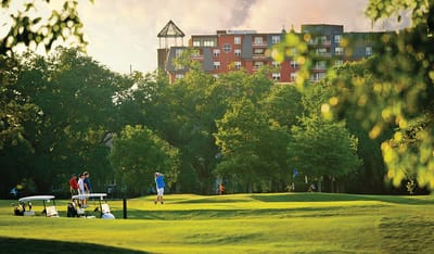 Residents enjoying outdoor golf activities at the facility
