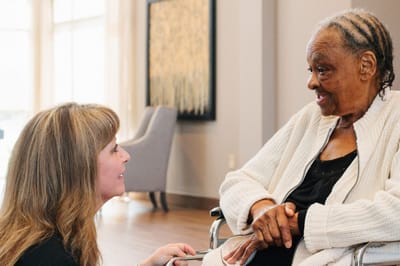 Staff member interacting with a resident in a common area