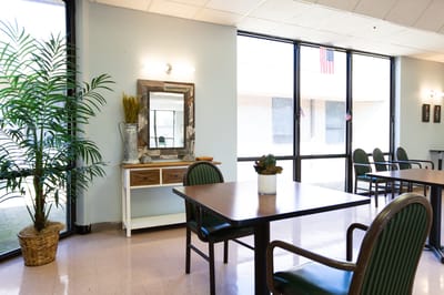 Interior of a brightly lit common area with furniture