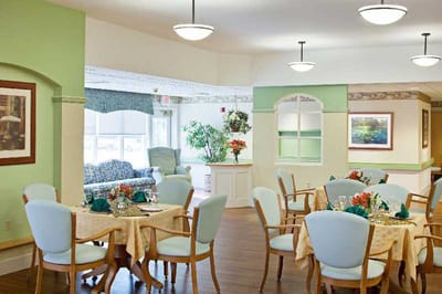 Bright dining room with tables set for a meal