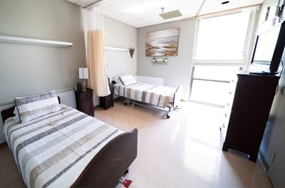Interior view of a shared resident room with two beds