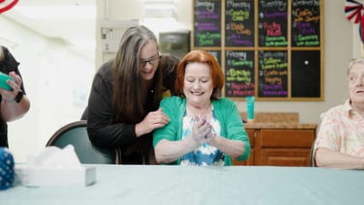 Residents and staff enjoying time together in a common area