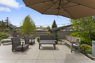 Outdoor seating area with patio furniture and plants