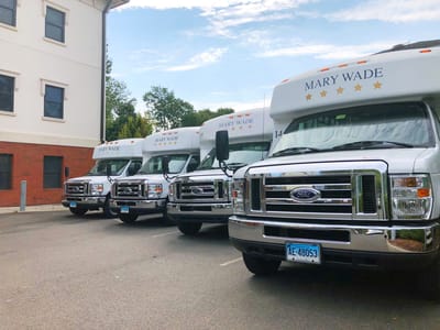Facility transport vehicles parked outside