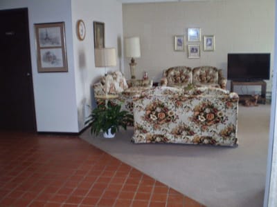 Cozy common area with floral furniture and decor