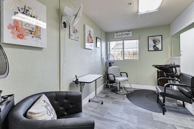 Interior salon area with chairs and decorations