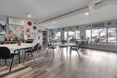Bright activity room with tables and decorations