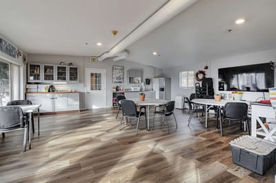 Bright interior of a common area with tables and chairs