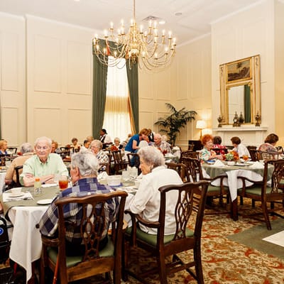 Residents enjoying a meal in the dining room