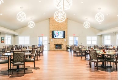 Bright and spacious dining room with tables and chairs