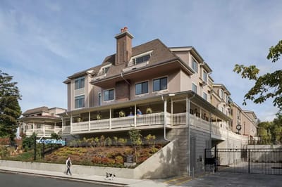 Exterior view of a senior living facility with landscaping