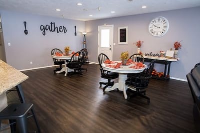 Bright common area with dining tables and decor