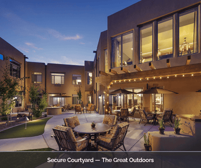 Outdoor courtyard with seating and evening lighting