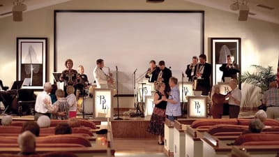 Residents dancing during a live band performance