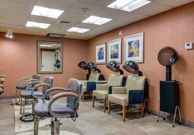 Interior view of a beauty salon with styling stations