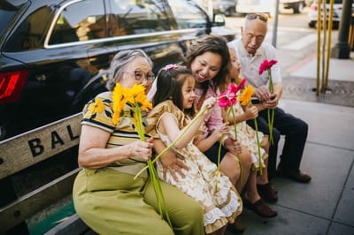 Residents and family members enjoying flowers together