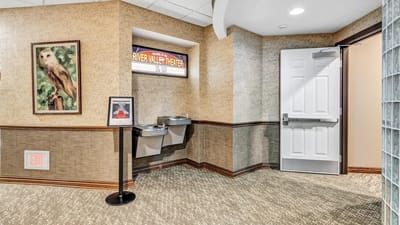 Interior hallway with water fountains and door